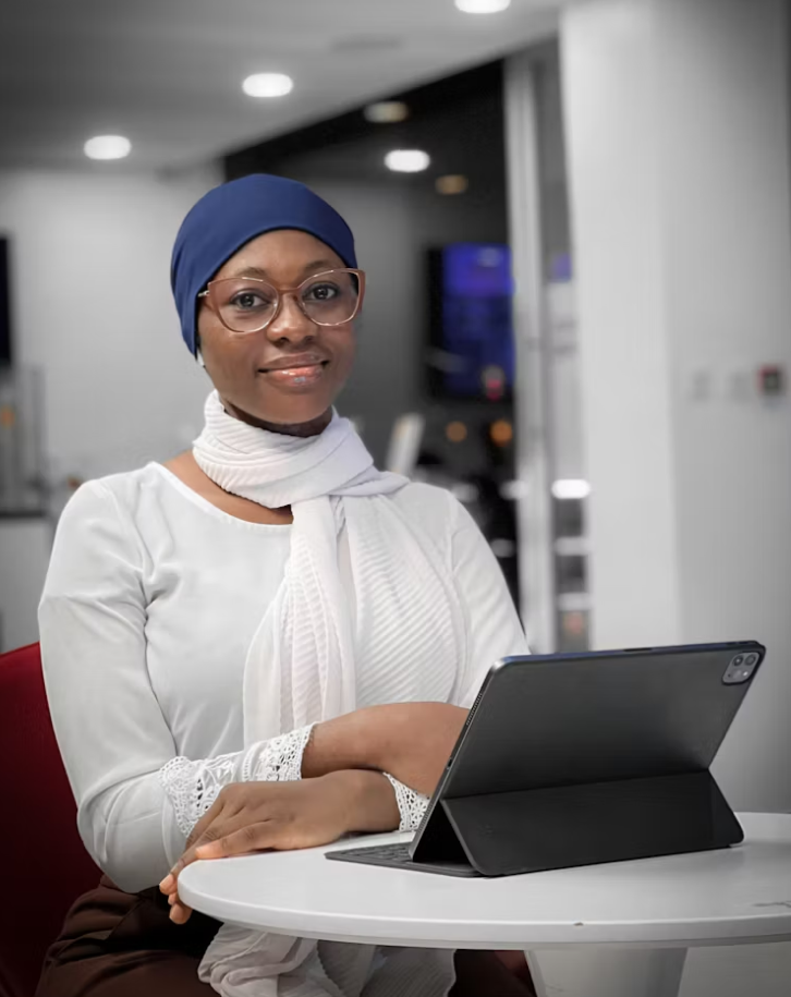 Healthcare professional working at a desk with a tablet